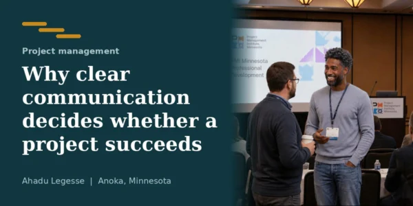 Ahadu Legesse talking with a colleague at a project management event in Minnesota
